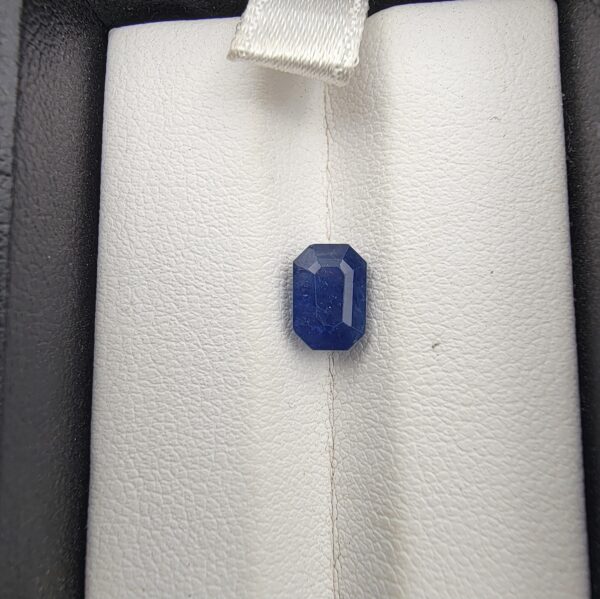 A 1.92-carat natural Ceylon Blue Sapphire featuring a vivid blue color and an octagon faceted cut, presented in a white jeweler's box.