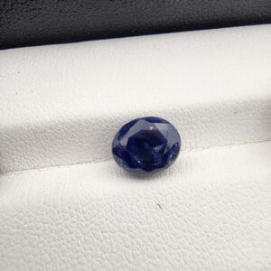 ​A 3.58-carat natural Ceylon blue sapphire with a vivid blue color and oval faceted cut, professionally displayed in a white jeweler's box.