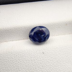 ​A 3.58-carat natural Ceylon blue sapphire with a vivid blue color and oval faceted cut, professionally displayed in a white jeweler's box.