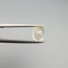 ​A 1.68-carat natural yellow sapphire from Sri Lanka (Ceylon) with a cushion faceted cut, displaying a bright canary yellow color and high transparency, presented in a white jeweler's box.