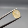 ​A 1.84-carat natural Ceylon yellow sapphire featuring an oval faceted cut and exceptional transparency, professionally displayed in a white jeweler's box.