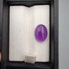 ​A 5.07-carat natural Brazilian amethyst with a rich purple color and faceted cut, accompanied by a GGI Laboratory certificate of authenticity.