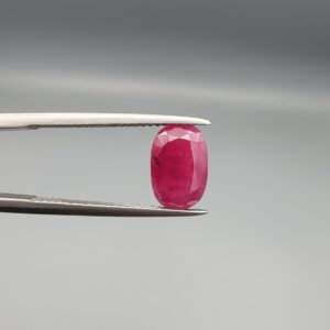 A 2.92-carat natural Mozambique ruby with a vivid Pigeon's Blood red color and faceted cut, professionally displayed in a jeweler's box.