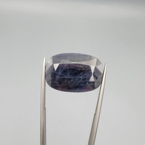 An extraordinary 26.56-carat natural blue sapphire from Afghanistan with an oval faceted cut and deep royal blue color, professionally displayed in a white jeweler's box.