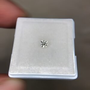 A single, brilliant-cut 0.17 carat natural white diamond (Heera) centered on a soft white background, displaying sharp internal faceting and high luster.