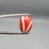 A 9.32-carat natural orangish-red Aqeeq gemstone with a prominent horizontal white band, presented in a professional jeweler's box.