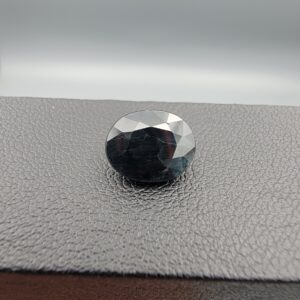 A 4.44-carat natural blue sapphire from Kanchanaburi, Thailand, featuring a classic oval faceted cut and rich royal blue color, displayed in a professional jeweler's box.