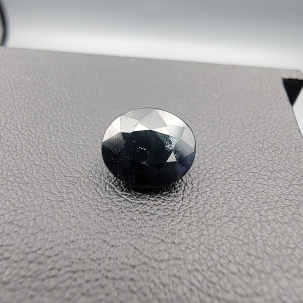 A 3.81-carat natural blue sapphire from Kanchanaburi, Thailand, showcasing a deep royal blue color and a classic oval faceted cut, presented in a professional white jeweler's box.