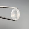 A massive 14.78-carat natural white sapphire from Sri Lanka, featuring a brilliant colorless clarity and masterful faceted cut, presented in a luxury jeweler's display box.