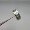 ​A premium handcrafted men's 925 sterling silver ring featuring a large oval-cut natural Ceylon blue sapphire center stone flanked by two vibrant, square-cut Swat Valley emerald side stones, displayed on a clean reflective surface.