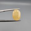 Official Galaxy Gemological Institute (GGI) Gemstone Report for a 6.25-carat Natural Yellow Sapphire. The certificate lists report number KHI260609001 and displays a digital product image of the loose, oval-cut semi-transparent stone resting on a white reflective surface, emphasizing its bright, sun-kissed yellow tone and prominent mixed faceting architecture.