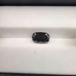 An official authenticity identification card from the Jaipur Gemological Lab for Specimen No. 5370152, certifying a 1.84-carat Natural Black Diamond. The certificate details a weight of 1.84 cts, measurements of 8.60 x 4.01 mm, an octagon shape, and an absolute hardness of 10, accompanied by a small photographic insert showing the faceted, opaque rectangular black diamond.