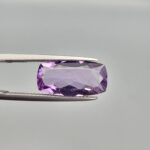 ​A high-clarity 4.81-carat natural Brazilian Amethyst gemstone beautifully presented in a luxury white-cushioned black display box. The loose gem displays an exceptionally rich, uniform royal violet color profile with a highly polished surface and magnificent internal light performance.