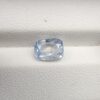 A premium, beautifully faceted 2.37-carat natural Blue Sapphire gemstone rests inside a white leatherette display box. The loose cushion-cut corundum gem displays a soft, icy light-blue tone with fine internal silk and genuine crystal characteristics that serve as an indisputable signature of its unheated, earth-mined origin.