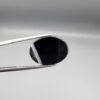 "Natural Black Banded Sulemani Aqeeq Agate oval cabochon gemstone 14.00 carat with white side banding held in tweezers"