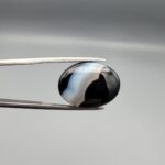 "Natural Black Banded Sulemani Aqeeq Agate oval cabochon gemstone 14.92 carat with diagonal white and brown band, front and back view"