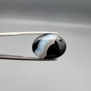 "Natural Black Banded Sulemani Aqeeq Agate oval cabochon gemstone 14.92 carat with diagonal white and brown band, front and back view"