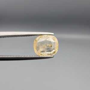 "Natural unheated Yellow Sapphire Pukhraj gemstone 2.22 carat cushion cut from Sri Lanka Ceylon held in tweezers showing natural inclusions"