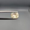 "Natural unheated Yellow Sapphire Pukhraj gemstone 1.99 carat cushion cut from Sri Lanka Ceylon held in tweezers showing bright faceting and natural inclusions"