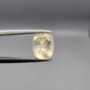 "Natural unheated Yellow Sapphire Pukhraj gemstone 1.99 carat cushion cut from Sri Lanka Ceylon held in tweezers showing bright faceting and natural inclusions"