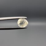 "Natural unheated Yellow Sapphire Pukhraj gemstone 0.72 carat pear cut from Sri Lanka Ceylon showing soft yellow color and natural inclusions"