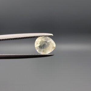 "Natural unheated Yellow Sapphire Pukhraj gemstone 0.72 carat pear cut from Sri Lanka Ceylon showing soft yellow color and natural inclusions"