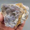 "Natural Fluorite crystal cluster specimen 1313 grams from Balochistan Pakistan showing large cubic purplish gray crystals with yellow limonite staining, held in hand"