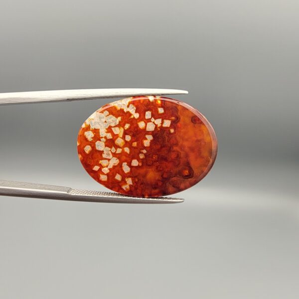 Natural Fire Agate oval cabochon 18.52 carat with orange honeycomb texture and druzy quartz crystals from Iran
