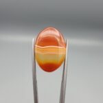 Natural orange and yellow banded chalcedony agate oval cabochon 18.26 carat from Iran