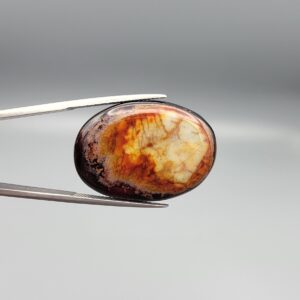 Natural Surkh Aqeeq oval cabochon 35.55 carat with translucent red black and cream marbled pattern from Iran