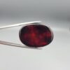 Natural Surkh Aqeeq oval cabochon 35.55 carat with translucent red black and cream marbled pattern from Iran