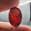 Natural Surkh Aqeeq oval cabochon 35.55 carat with translucent red black and cream marbled pattern from Iran