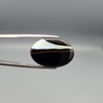 Natural Black Sulemani Agate oval cabochon 21.86 carat gemstone from Iran with white banded eye stripe