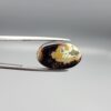 Natural black chalcedony agate oval cabochon 12.03 carat with cream and moss-green mineral inclusion from Iran