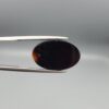 Natural black chalcedony agate oval cabochon 12.03 carat with cream and moss-green mineral inclusion from Iran