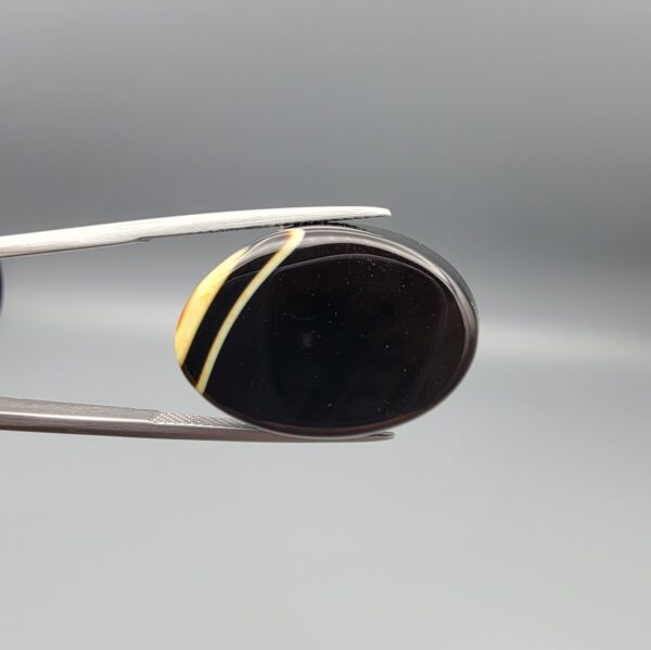 Natural Black Banded Sulemani Agate oval cabochon 30.20 carat gemstone from Iran with cream white eye band