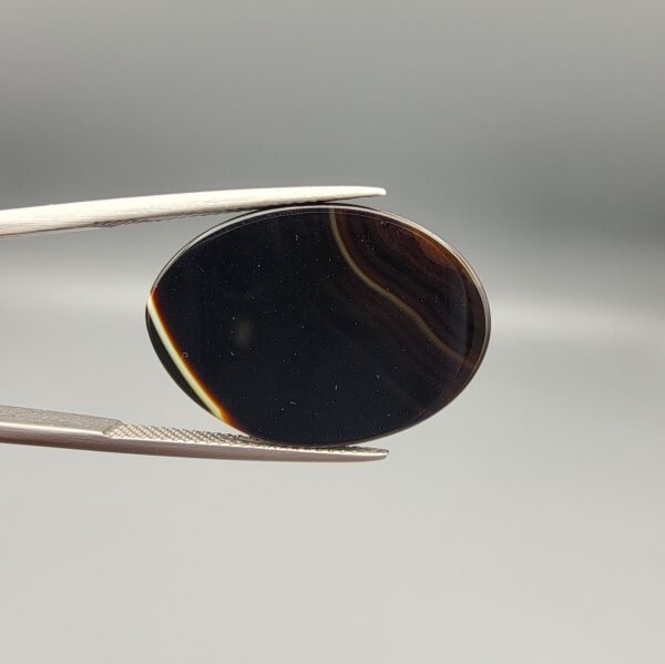 Natural Black Banded Sulemani Agate oval cabochon 30.20 carat gemstone from Iran with cream white eye band