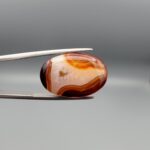 Natural multi-color banded Sulemani agate oval cabochon 20 carat with cream orange and maroon bands from Iran