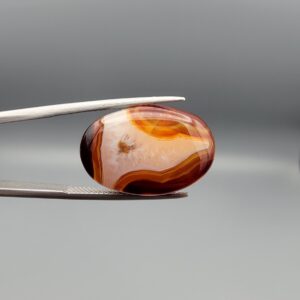 Natural multi-color banded Sulemani agate oval cabochon 20 carat with cream orange and maroon bands from Iran