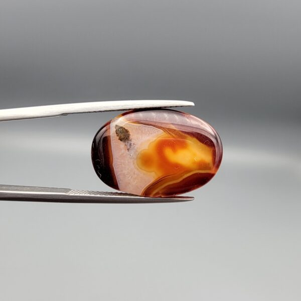 Natural multi-color banded Sulemani agate oval cabochon 20 carat with cream orange and maroon bands from Iran