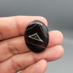 Natural black Sulemani agate oval cabochon 44.80 carat with natural triangular eye pattern from Iran