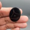 Natural black Sulemani agate oval cabochon 44.80 carat with natural triangular eye pattern from Iran