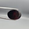 Natural black Sulemani agate oval cabochon 22.52 carat with natural orange tortoise-shaped mineral inclusion from Iran
