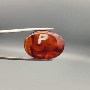 Natural Surkh Aqeeq oval cabochon 27.13 carat translucent red agate with natural white letter P shaped inclusion from Iran
