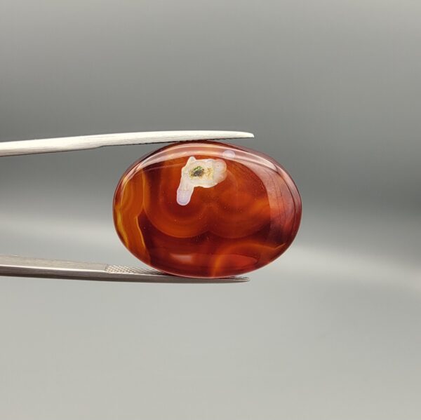 Natural Surkh Aqeeq oval cabochon 27.13 carat translucent red agate with natural white letter P shaped inclusion from Iran