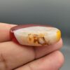 Natural multi-color Sulemani agate oval cabochon 69.42 carat with translucent red and cream mottled zones from Iran