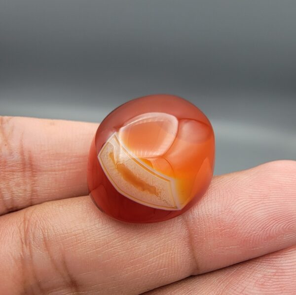 Natural multi-color Sulemani agate oval cabochon 70 carat with red orange and white banded pattern from Iran
