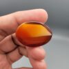 Natural multi-color Sulemani agate oval cabochon 70 carat with red orange and white banded pattern from Iran