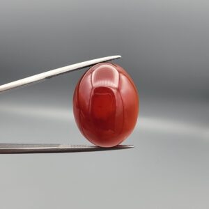 Natural multi-color Sulemani agate oval cabochon 28.53 carat red and black banding with raw natural back from Iran
