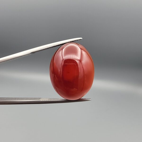 Natural multi-color Sulemani agate oval cabochon 28.53 carat red and black banding with raw natural back from Iran